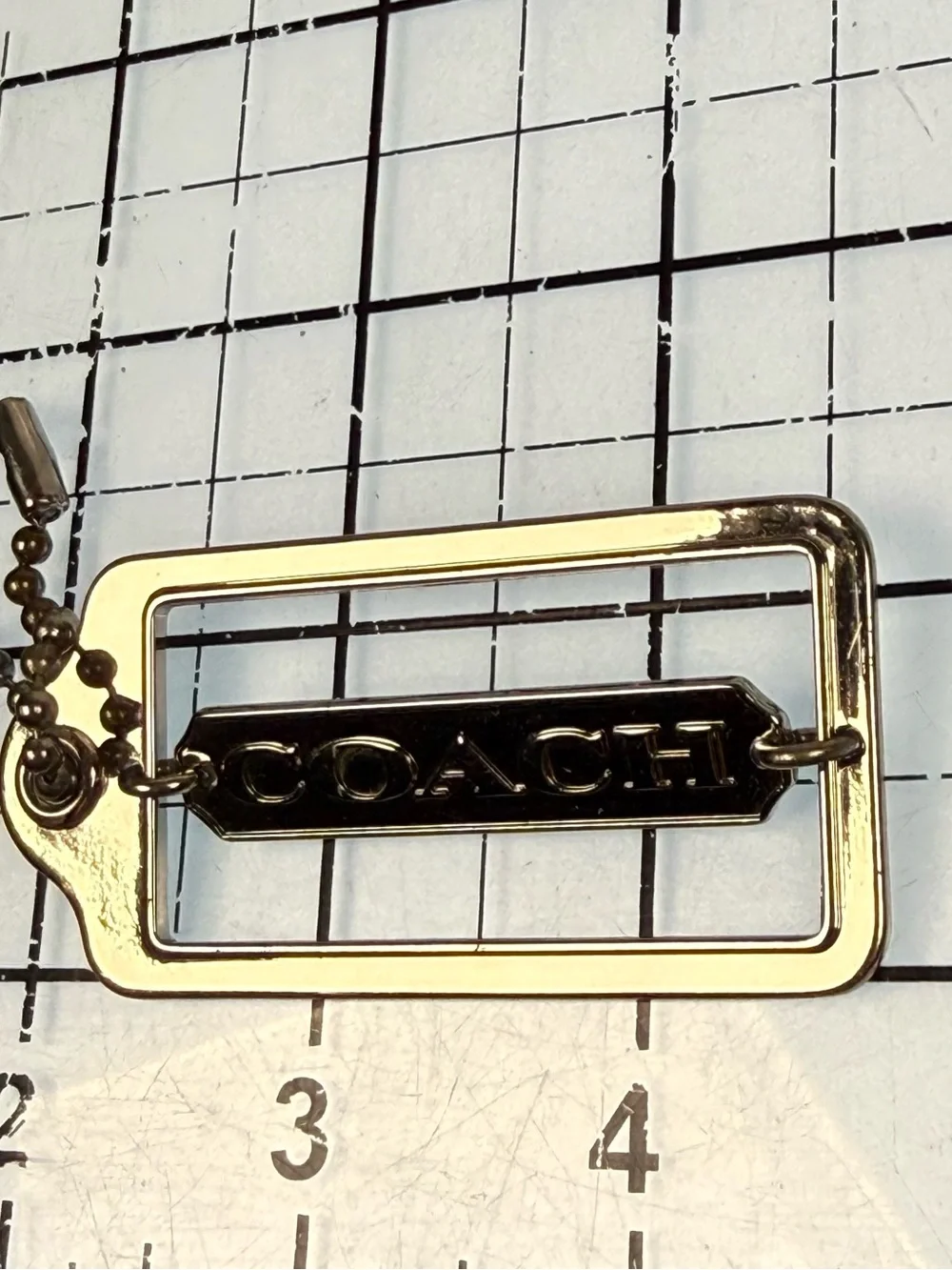 Coach gold tone